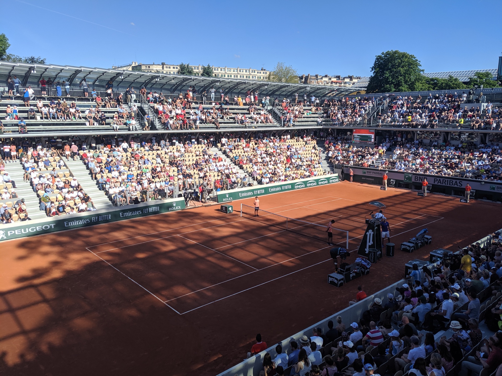 The clay Court Simonne-Mathieu and spectators at Roland-Garros.